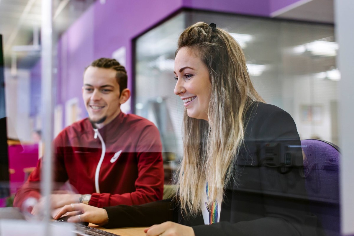 Careers member of staff helping student