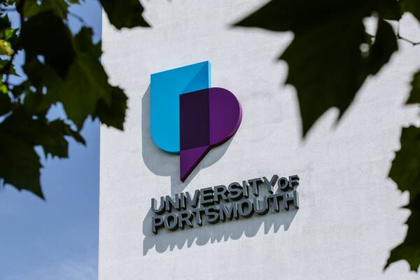 University of Portsmouth logo on Dennis Sciama wall