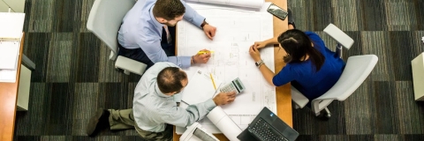 Staff looking at building plans