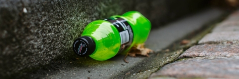 Plastic bottle in the gutter